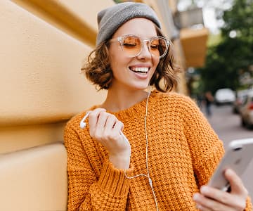 Happy girl in orange sweater